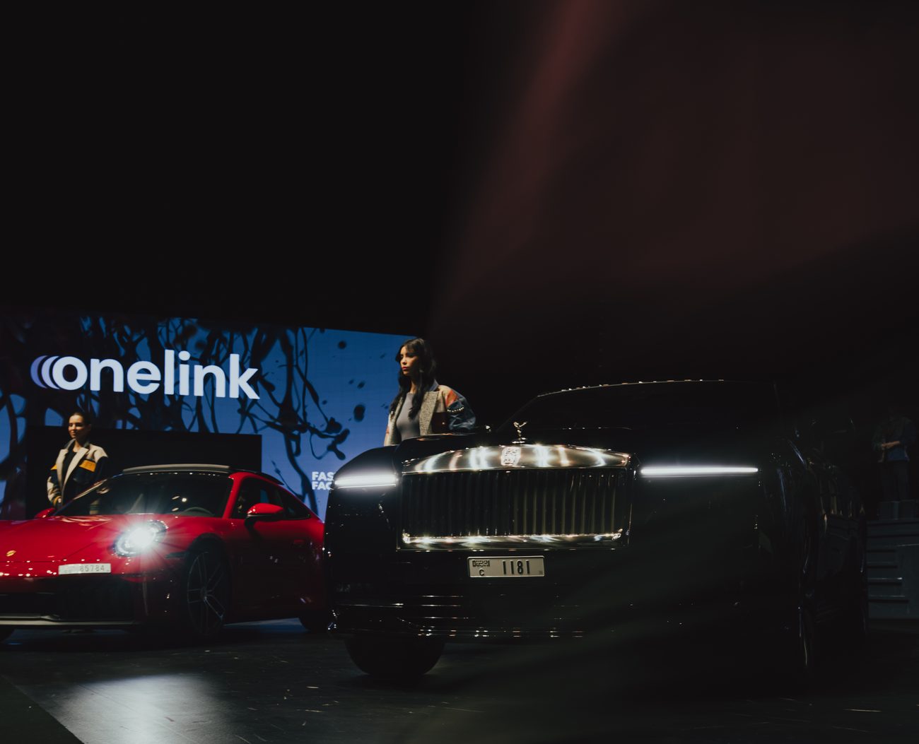 Onelink Rentals luxury cars on display at a Dubai event
